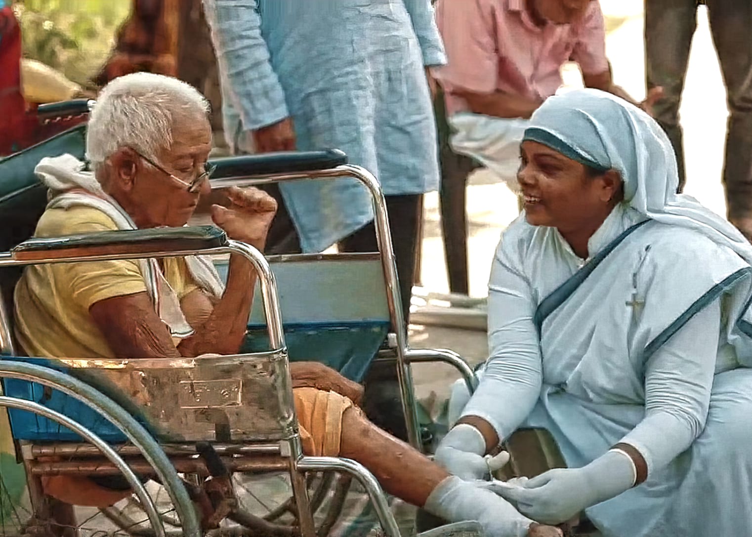 Geeta, Sisters of the Cross, cleans and bandages the wounds of a leprosy patient