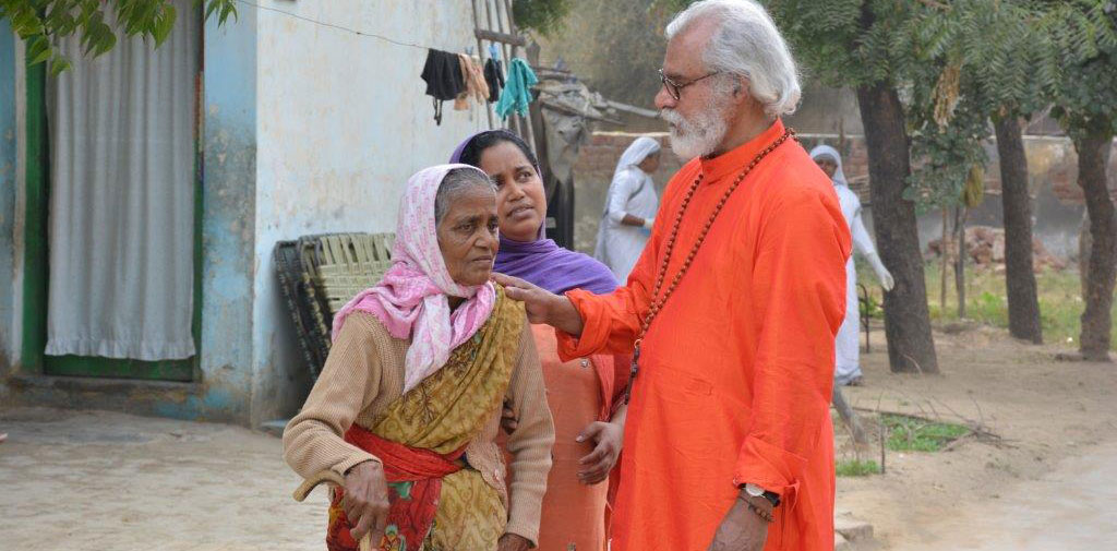 K.P. Yohannan with a leprosy patient