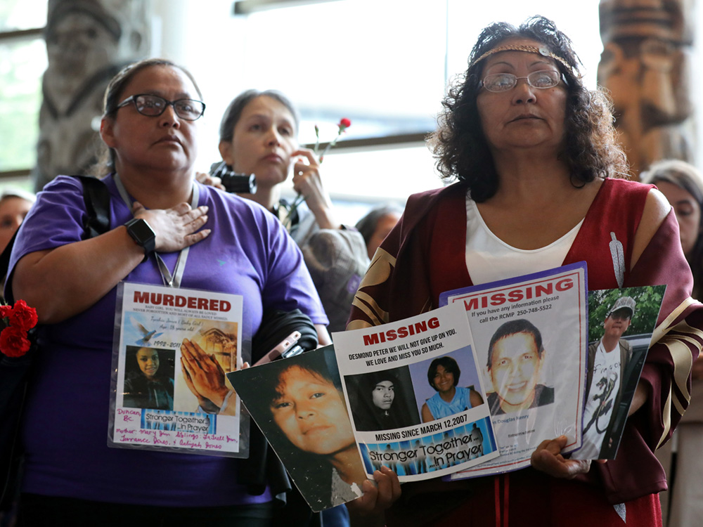 Women attend the closing ceremony of the National Inquiry into Missing and Murdered Indigenous Women and Girls